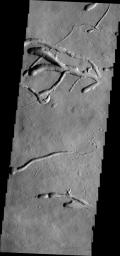 This image from NASA's 2001 Mars Odyssey spacecraft of the eastern flank of Ascraeus Mons shows multiple collapse features.