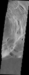 This image captured by NASA's 2001 Mars Odyssey spacecraft shows part of the complex caldera at the summit of Ascraeus Mons.