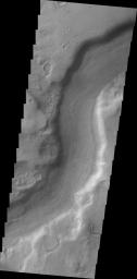 A small section of Dao Vallis in shown in this image from NASA's 2001 Mars Odyssey spacecraft. Dao Vallis is a major channel that drains into Hellas Planitia.