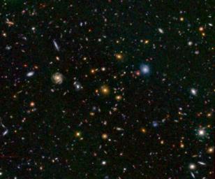 This image from NASA's Hubble telescope shows one of the most distant galaxies known, called GN-108036, dating back to 750 million years after the Big Bang that created our universe. The galaxy's light took 12.9 billion years to reach us.