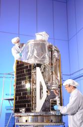 Engineers in the final stages of assembling NASA's Nuclear Spectroscopic Telescope Array, or NuSTAR, at Orbital Sciences Corporation in Dulles, Va., January 2012.