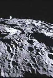 This image of the far side of the lunar surface, with Earth in the background, is of crater De Forest and was taken by NASA's MoonKAM system onboard the Ebb spacecraft.