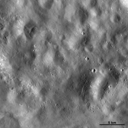 This image of asteroid Vesta from NASA's Dawn spacecraft shows a region of the surface that is rather smooth in appearance which is located in Vesta's Marcia quadrangle, near the Vestan equator.