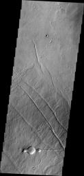 This image from NASA's 2001 Mars Odyssey spacecraft of the Tharsis region illustrates relative age relations. Fractures occurred in old lava flows and then younger lava flows covered the fractures.
