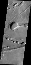 This image from NASA's 2001 Mars Odyssey spacecraft shows the complex collapse features on the southern flank of Ascraeus Mons.