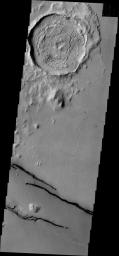 The dark fractures in this image from NASA's 2001 Mars Odyssey spacecraft are part of Cerberus Fossae.