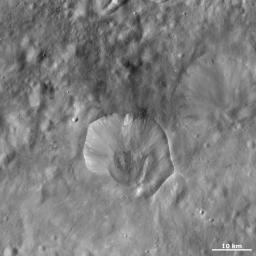 This image from NASA's Dawn spacecraft of asteroid Vesta shows Drusilla crater, which is the irregularly shaped crater offset from the center of the image.