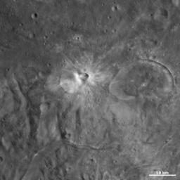 This image from NASA's Dawn spacecraft of asteroid Vesta shows Eusebia crater on the right. The smaller crater, offset from the center of the image, with a smaller crater on its rim is Tuccia crater.