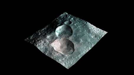 This image from NASA's Dawn mission shows a 3-D rendering of the craters that make up the 'snowman' feature on the giant asteroid Vesta. From left to right, the craters are named Marcia, Calpurnia, and Minucia.