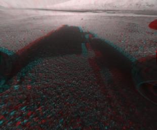This image is a 3-D view in front of NASA's Curiosity rover captured by the rover's front left Hazard-Avoidance camera. The image is cropped but part of Mount Sharp is still visible rising above the terrain.