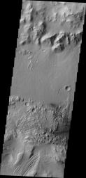 Moving eastward from the previous image, we continue to see the northern floor and rim of Gale Crater and the northern part of Mt. Sharp. This image from NASA's Mars Odyssey spacecraft shows a weathered region of the lower elevations of Mt. Sharp.