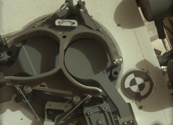 This subframe image from the left Mastcam on NASA's Mars rover Curiosity shows the covers in place over two sample inlet funnels of the rover's Sample Analysis at Mars (SAM) instrument suite.