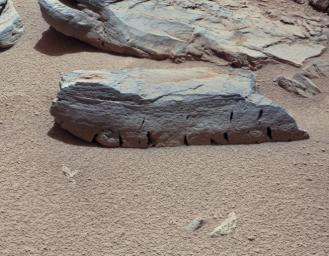 This view of a Martian rock called 'Rocknest 3' combines four images taken by the right-eye camera of the Mast Camera (Mastcam) instrument. The image has been white-balanced to show what the rock would look like if it were on Earth.