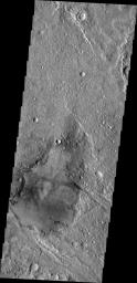 This image from NASA's 2001 Mars Odyssey spacecraft shows a young crater. Dark radial spokes are created by the explosive blast of an impact event. With time, only thick ejecta near the rim of the crater will be visible, and dark spokes will disappear.
