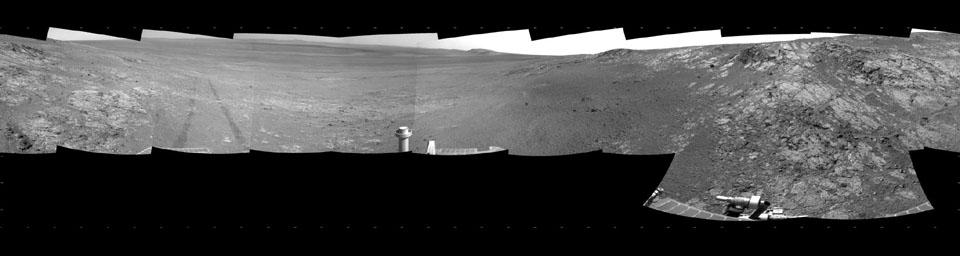 This full-circle, panorama shows the terrain around the NASA Mars Exploration Rover Opportunity on part of a relatively flat, light-toned outcrop called 'Whitewater Lake.' The basin of Endeavour Crater is in the left half of the image.