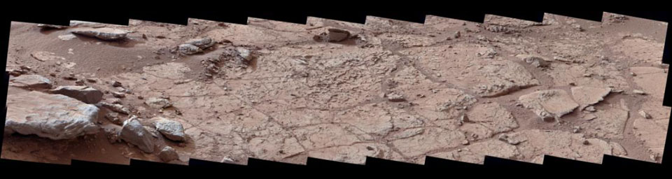 This wide view of the 'John Klein' location selected for the first rock drilling by NASA's Mars rover Curiosity is a mosaic taken by Curiosity's right Mast Camera (Mastcam).