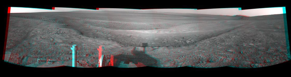 This 3-D view from the navigation camera on NASA's Mars Exploration Rover Opportunity shows a vista across Endeavour Crater, with the rover's own shadow in the foreground.