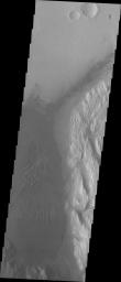 Showing the area just slightly west of the previous image, the large region of sand and sand dunes are the dark area that dominates this image captured by NASA's 2001 Mars Odyssey spacecraft.