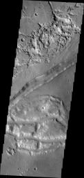 The large fracture in this image captured by NASA's 2001 Mars Odyssey spacecraft is located on the margin of Aurorae Chaos.