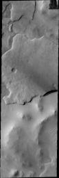 This image from NASA's Mars Odyssey spacecraft shows martian terrain that looks like a giant fish with open mouth.