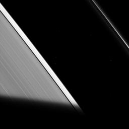 The shadow of Saturn cuts across the rings as seen by NASA's Cassini spacecraft. As the ring particles enter Saturn's shadow, their temperature drops to even colder temperatures, only to warm back up again when they re-emerge into the sunlight.