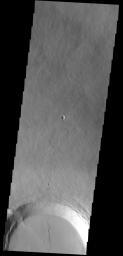 Part of the summit caldera of Olympus Mons is visible at the bottom of this image as seen by NASA's 2001 Mars Odyssey spacecraft.