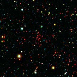 The collection of red dots seen here show one of several very distant galaxy clusters discovered by combining ground-based optical data from the NOAO's Kitt Peak National Observatory with infrared data from NASA's Spitzer Space Telescope.