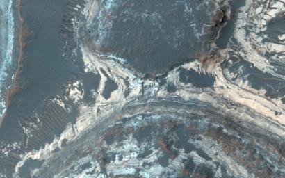 Excellent exposures of light-toned layered deposits occur along the northern edge of Hellas Basin as seen by NASA's Mars Reconnaissance Orbiter.
