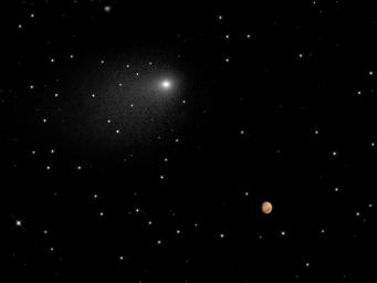 This synthesized composite of NASA Hubble Space Telescope images captures the positions of comet Siding Spring and Mars in a never-before-seen close passage of a comet by the Red Planet.