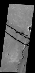 The fractures in this image are part of a large system of fractures called Cerberus Fossae. Athabasca Valles is visible in the lower right corner of the image as seen by NASA's 2001 Mars Odyssey spacecraft.