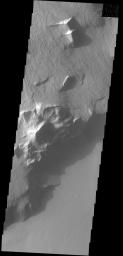This image captured by NASA's 2001 Mars Odyssey spacecraft shows part of the escarpment that encircles Olympus Mons. This image is located on the southeastern flank of the volcano.