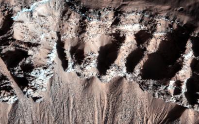 This image, acquired by NASA's Mars Reconnaissance Orbiter, in southern winter over part of Asimov Crater, shows the crater appears to have been completely filled by a thick sequence of materials, perhaps including sediments and lava flows.