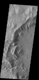 Numerous channels dissect the rim of this large crater located on Acheron Fossae as seen by NASA's 2001 Mars Odyssey spacecraft.