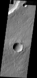 Dark slope streaks are found everywhere on the inner rim of this unnamed crater in Arabia Terra in this image captured by NASA's 2001 Mars Odyssey spacecraft.