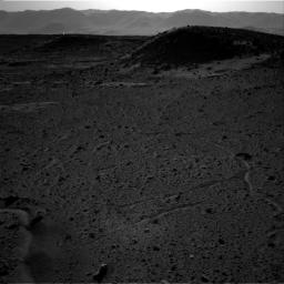 This image from NASA's Curiosity Mars rover, taken on April 3, 2014, includes a bright spot near the upper left corner. Possible explanations include a glint from a rock or a cosmic-ray hit.