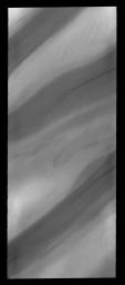 With summer fast approaching, the frost has sublimated away and the layers that make up the north polar cap are easily discernible, as seen by NASA's 2001 Mars Odyssey spacecraft.