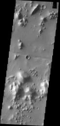 Dark slope streaks mark many of the hills in this image captured by NASA's 2001 Mars Odyssey spacecraft. This region of hills is called Tartarus Colles. The term colles means small hills or knobs.