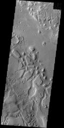 Regions of mesas and channels are termed chaos. This region on the margin of Terra Sabaea has several areas of chaos, as shown in this image from NASA's 2001 Mars Odyssey spacecraft.