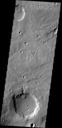 A delta deposit sits on the floor of this unnamed crater in Arabia Terra, as shown in this image from NASA's 2001 Mars Odyssey spacecraft. The channel that created the delta dissects the crater rim.
