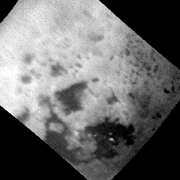 This frame from an animated sequence of NASA's Cassini images shows methane clouds moving above the large methane sea on Saturn's moon Titan known as Ligeia Mare.