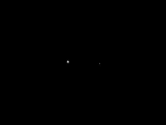 This image of Earth (at left) and the moon (at right) was taken by NASA's Juno spacecraft as part of a checkout of the probe's instruments following launch.