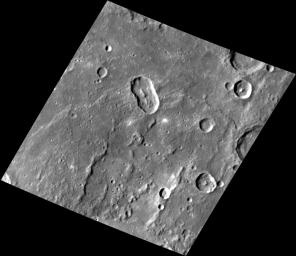 At an Angle. This image NASA's MESSENGER features an elongated impact crater north of Rembrandt impact basin. This crater was most likely formed by a oblique impact which created the crater's distinct elongated shape and central peak.