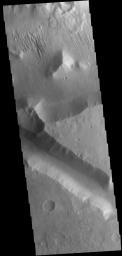This image captured by NASA's 2001 Mars Odyssey spacecraft shows a small portion of Aeolis Mensae, a complex region of hills, plateaus and graben.