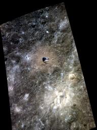 Hemingway crater is seen in this color view of Mercury's surface as seen by NASA's MESSENGER spacecraft. Hemingway is the 130-km (81-mile) diameter crater with a relatively brown floor and small patch of dark blue in its center.