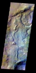 The THEMIS VIS camera contains 5 filters. The data from different filters can be combined in multiple ways to create a false color image. This false color image from NASA's 2001 Mars Odyssey spacecraft shows part of the floor of Proctor Crater.