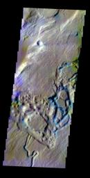 The THEMIS VIS camera contains 5 filters. The data from different filters can be combined to create a false color image. This false color image from NASA's 2001 Mars Odyssey spacecraft shows part of a tributary channel that empties into Ares Vallis.