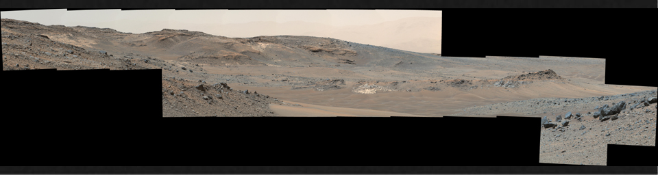 This April 16, 2015, panorama from the Mast Camera on NASA's Curiosity Mars rover shows a detailed view toward two areas, 'Mount Shields' and 'Logan Pass,' on lower Mount Sharp, chosen for close-up inspection in subsequent weeks.