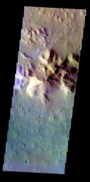 The THEMIS VIS camera contains 5 filters. The data from different filters can be combined to create a false color image. This image from NASA's 2001 Mars Odyssey spacecraft shows part of the inner peak and floor of an unnamed crater in Terra Cimmeria.
