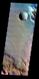 The THEMIS VIS camera contains 5 filters. The data from different filters can be combined in multiple ways to create a false color image. This false color image from NASA's 2001 Mars Odyssey spacecraft shows part of the rim and floor of Saheki Crater.