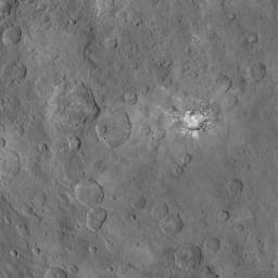 This image, taken June 6, 2015 by NASA's Dawn spacecraft, shows Haulani crater on Ceres from an altitude of 2,700 miles (4,400 kilometers) with a resolution of 1,400 feet (410 meters) per pixel. North on Ceres is toward upper right.